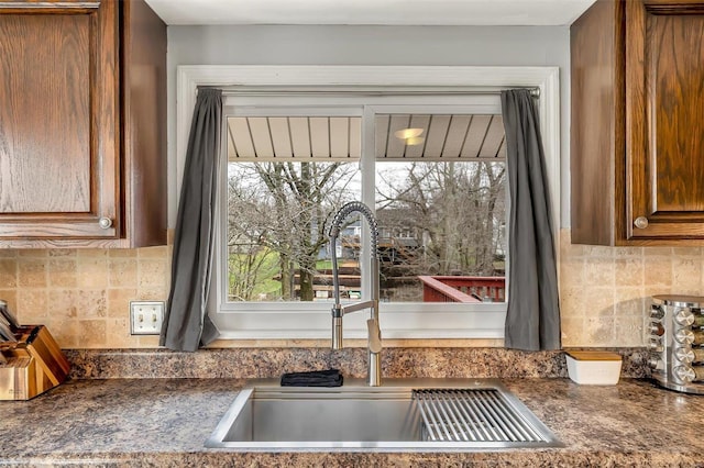 kitchen with tasteful backsplash and sink