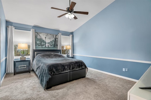 carpeted bedroom featuring ceiling fan and high vaulted ceiling