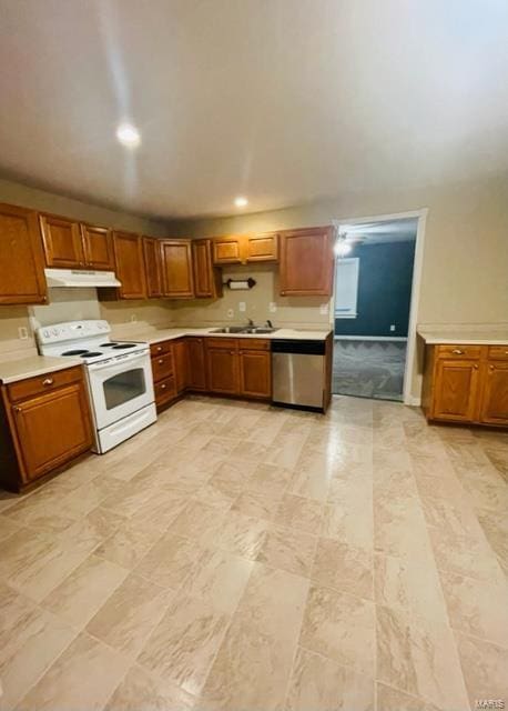 kitchen with electric range, dishwasher, and sink