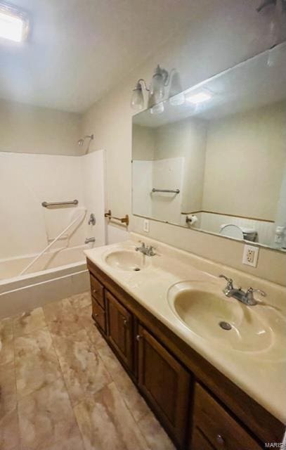 bathroom with vanity and tub / shower combination