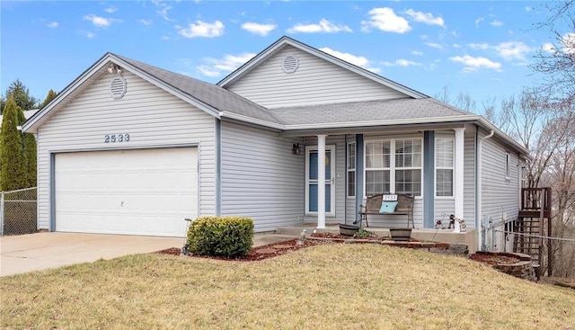 view of front of property with a garage and a front lawn