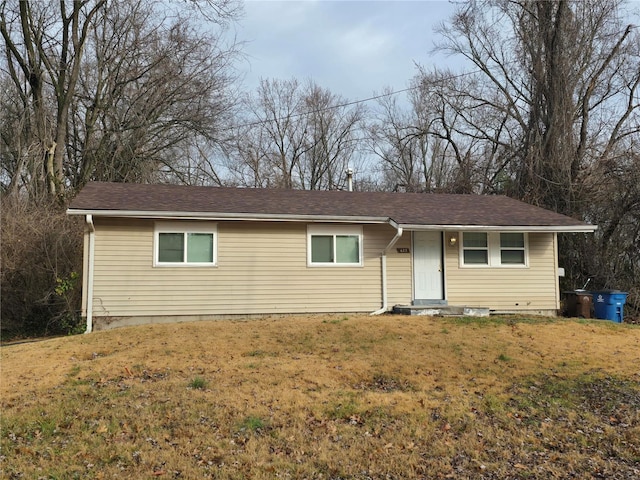 ranch-style home with a front lawn