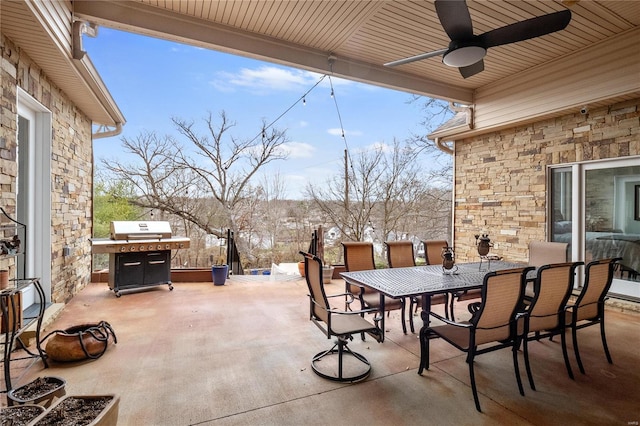 view of patio featuring ceiling fan and a grill