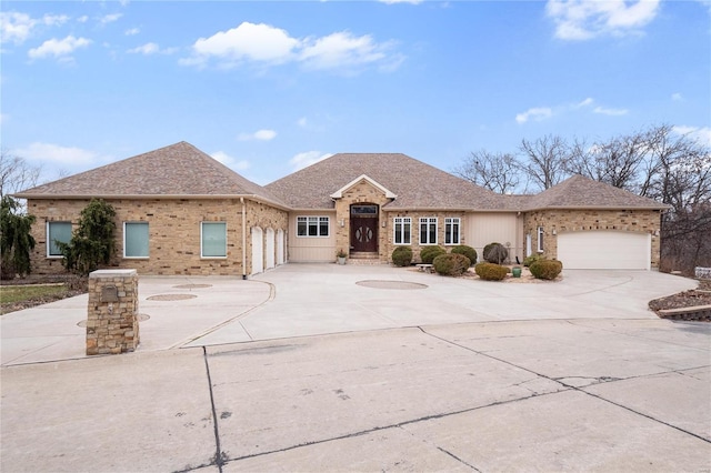 ranch-style house featuring a garage