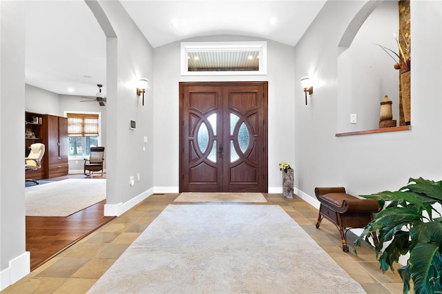 entrance foyer featuring ceiling fan and vaulted ceiling