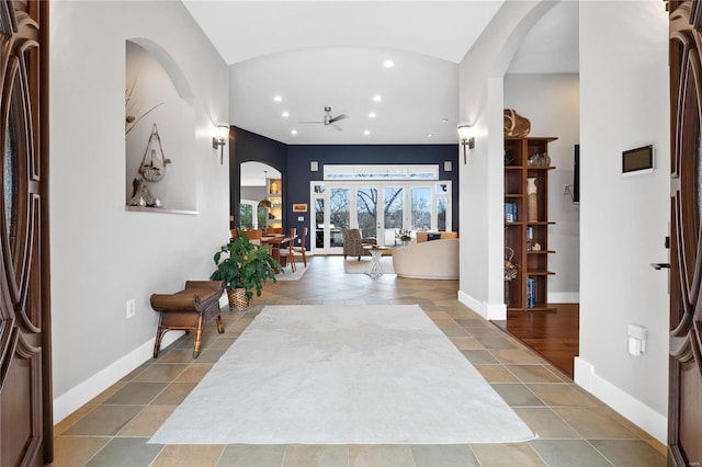 entrance foyer featuring tile patterned flooring and ceiling fan