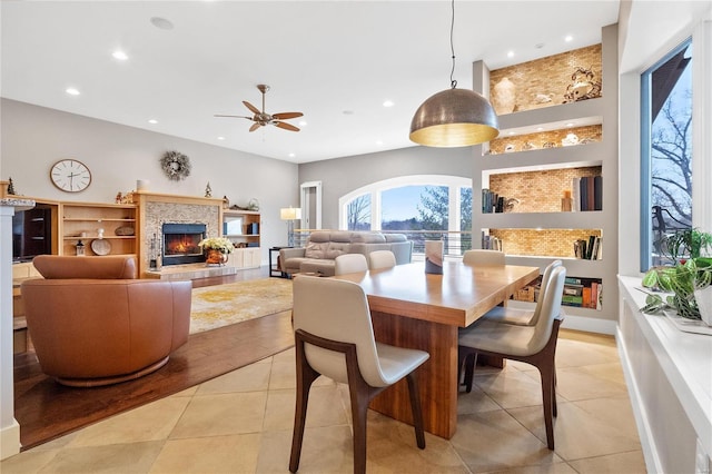 tiled dining room with ceiling fan