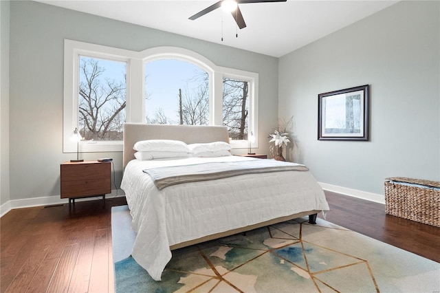 bedroom featuring ceiling fan and dark hardwood / wood-style floors