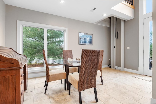 dining area featuring light tile patterned floors