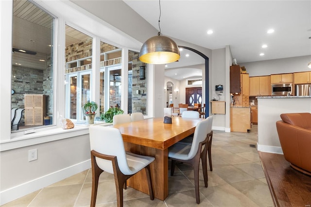 dining area featuring light tile patterned floors