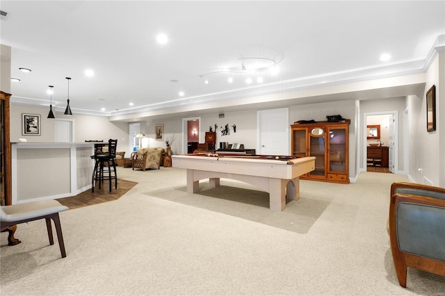 recreation room featuring light colored carpet, crown molding, and pool table