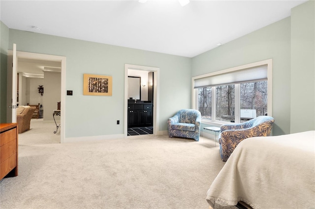 carpeted bedroom with connected bathroom