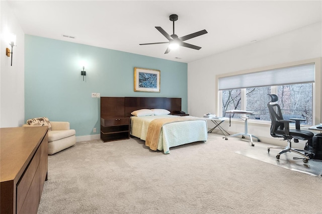 bedroom featuring ceiling fan and light carpet