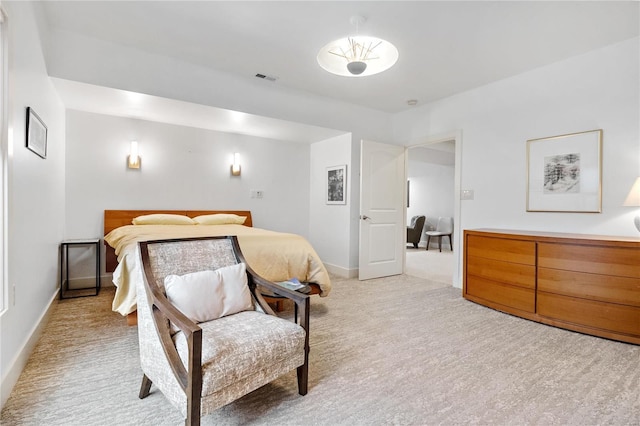 bedroom featuring light colored carpet