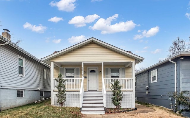 bungalow-style house featuring covered porch