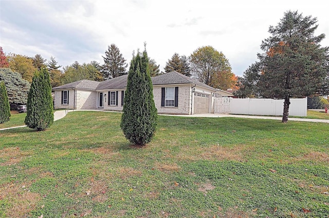 exterior space with a front yard and a garage