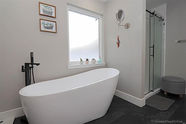 bathroom with separate shower and tub