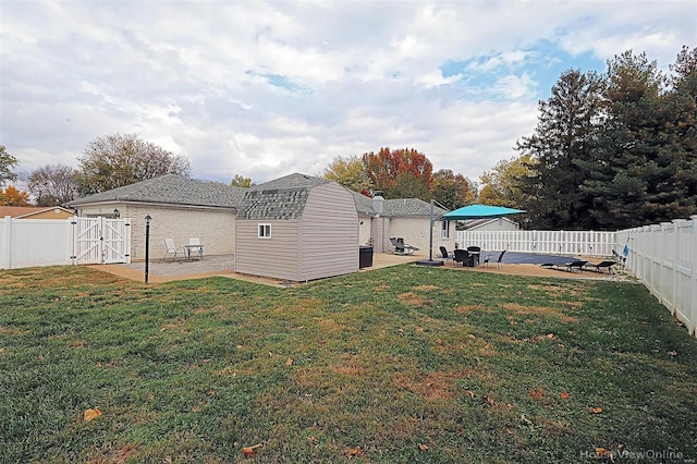 view of yard with a patio area and a shed