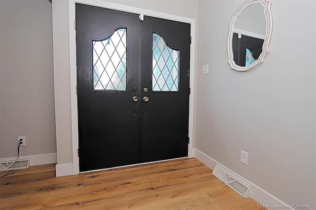 foyer entrance with wood-type flooring