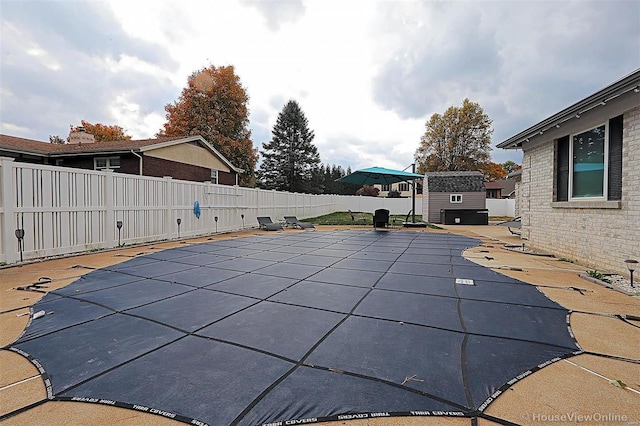 view of swimming pool featuring a patio area