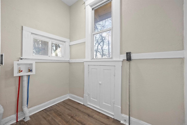 doorway to outside featuring dark wood-type flooring