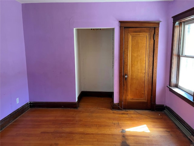 empty room featuring wood-type flooring