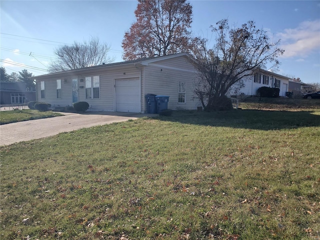 view of side of property with a garage and a yard