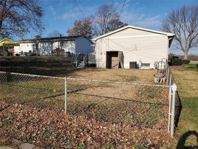 view of side of home featuring central air condition unit