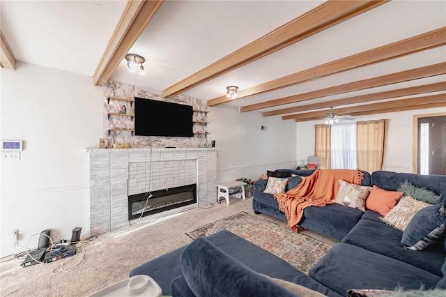 living room featuring ceiling fan, carpet, and beam ceiling