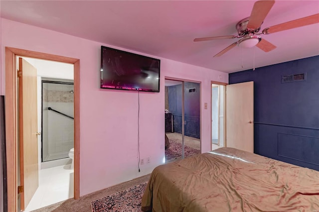 bedroom featuring ceiling fan, light carpet, a closet, and ensuite bathroom