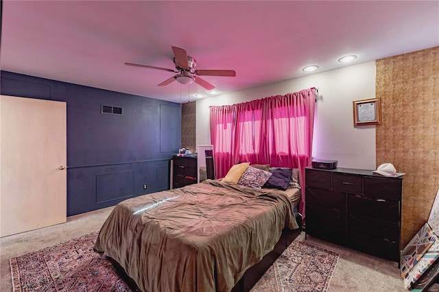 carpeted bedroom with ceiling fan