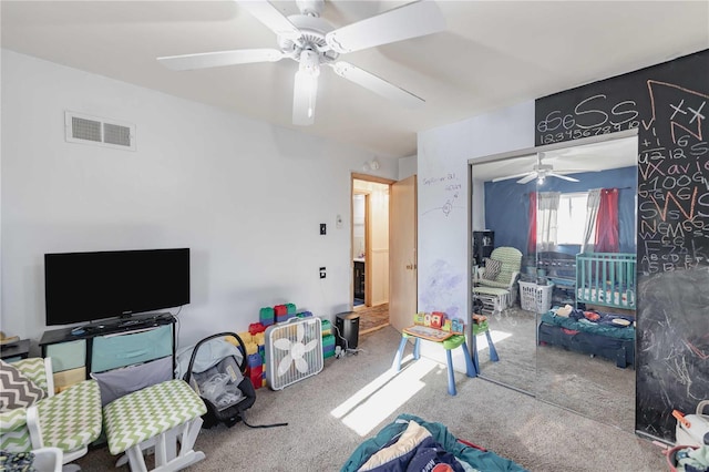 living room with ceiling fan and carpet floors