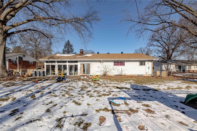 view of snow covered house