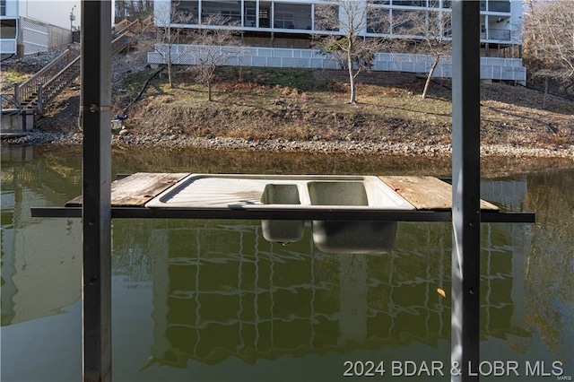 dock area featuring a water view