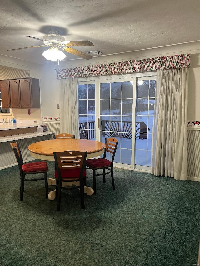 dining room featuring ceiling fan and carpet floors