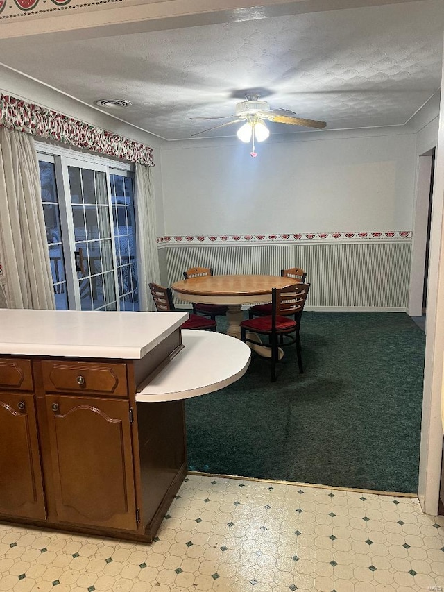 dining area featuring a textured ceiling