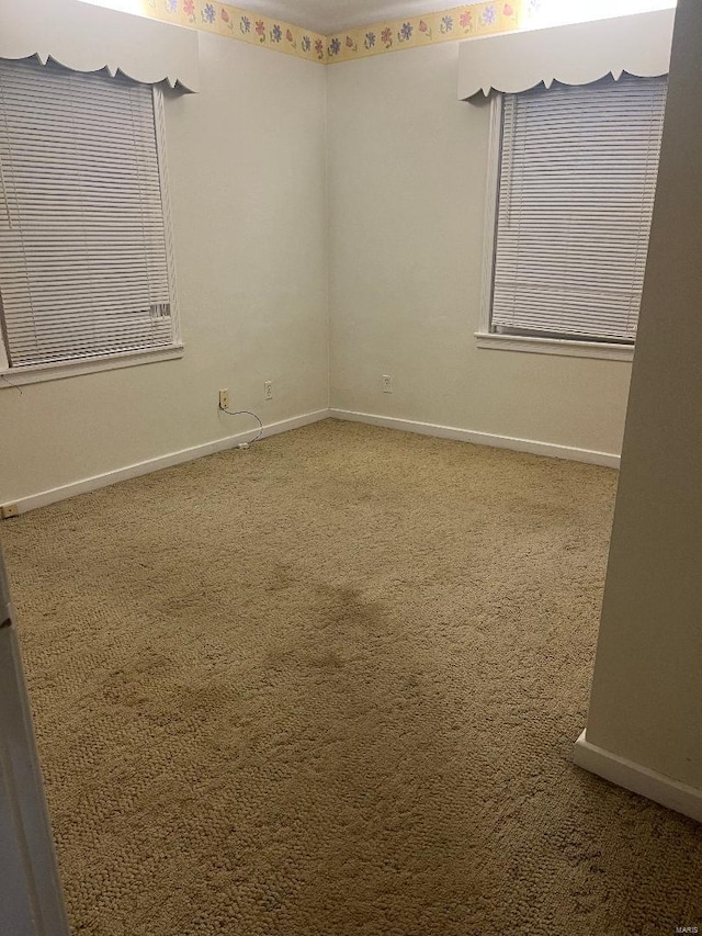 spare room with carpet flooring