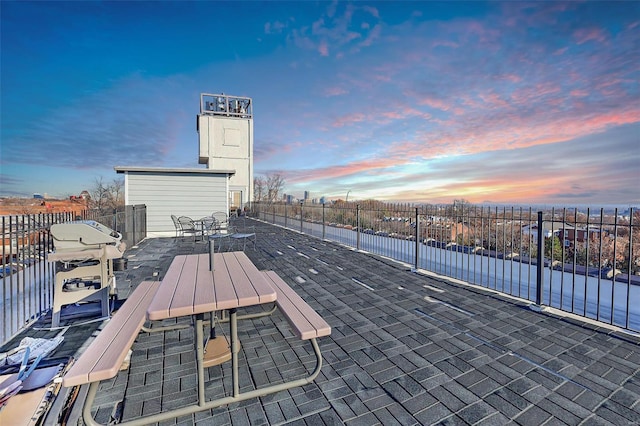 view of patio terrace at dusk