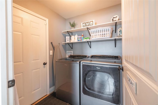 laundry area with washing machine and clothes dryer