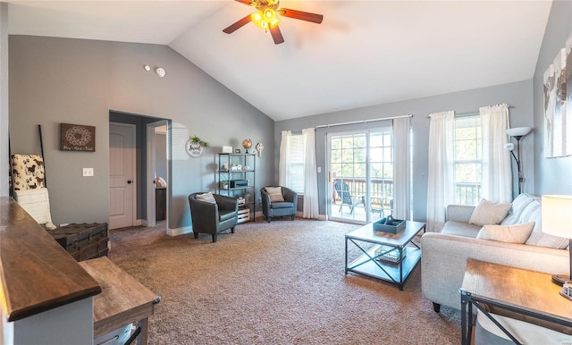 carpeted living room with ceiling fan and lofted ceiling