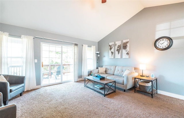 living room with carpet floors and vaulted ceiling