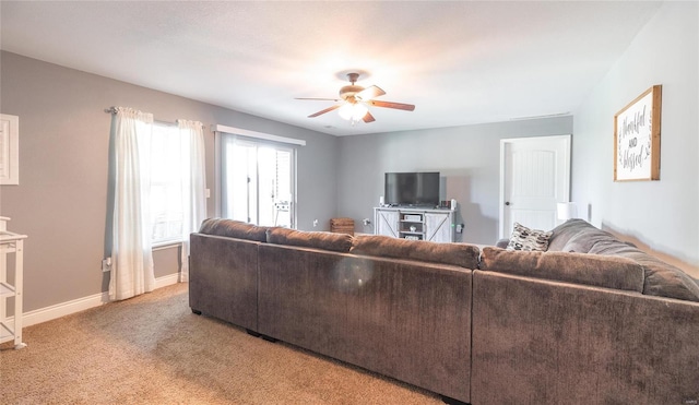 living room featuring carpet and ceiling fan