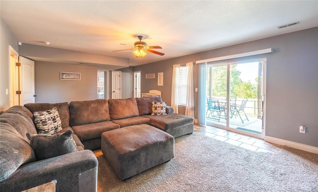 living room featuring light carpet and ceiling fan