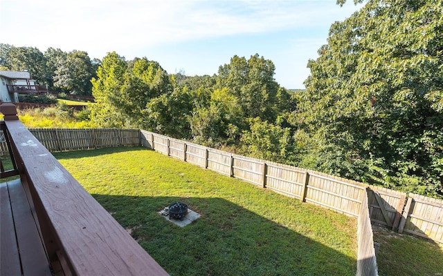 view of yard with a fire pit and a wooden deck