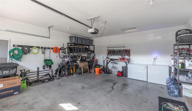 garage with a garage door opener and fridge