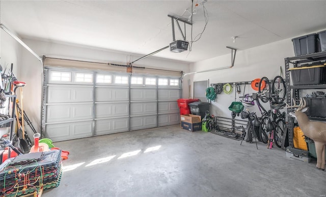 garage featuring a garage door opener