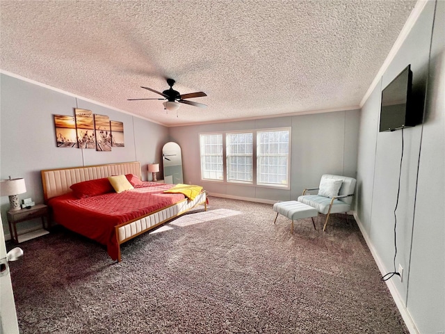 bedroom featuring carpet flooring, ceiling fan, and crown molding