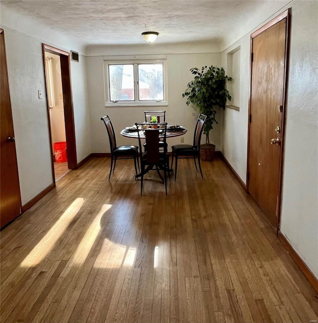 dining area featuring hardwood / wood-style floors