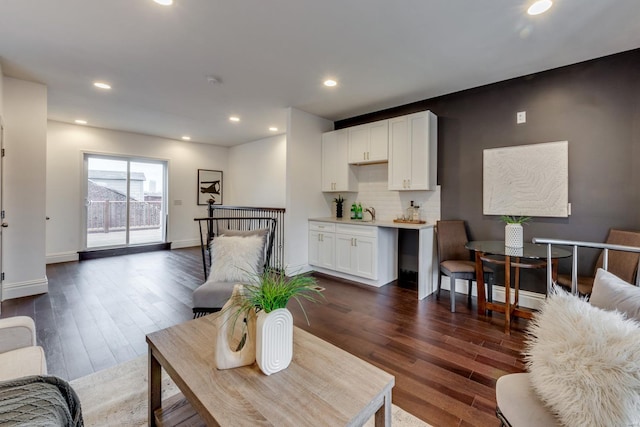 living room featuring dark hardwood / wood-style flooring