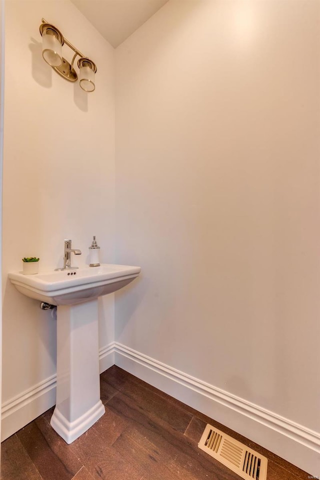 bathroom featuring hardwood / wood-style floors and sink